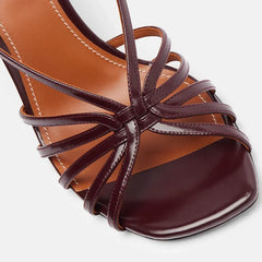 Close-up of strappy wedge heel sandals