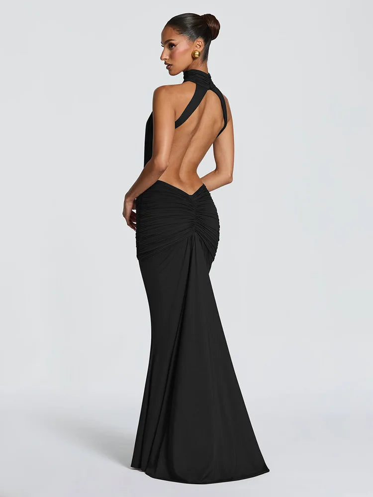 Black evening gown with open back on a white background