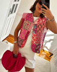 Patchwork floral print quilted vest worn by a model
