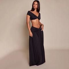 Side view of twisted V-neck crop top and gathered maxi skirt set
