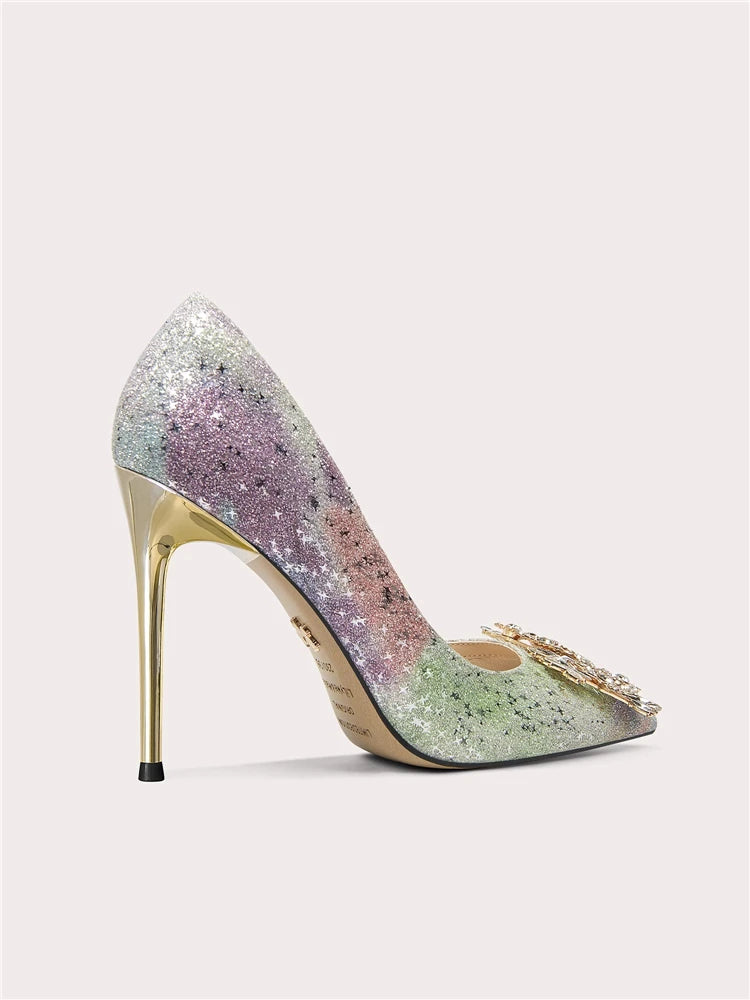 Multicolored glitter high-heeled shoe on a light gray background