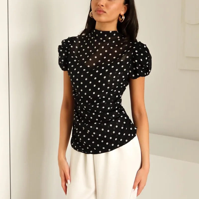 Black polka dot mesh top with puff sleeves