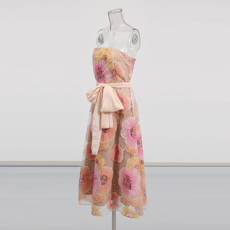 Floral dress on a mannequin against a white background