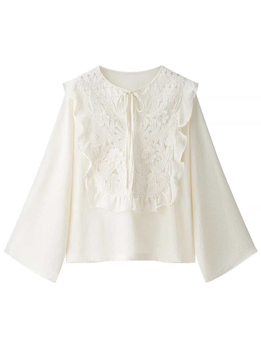 White lace blouse on a white background
