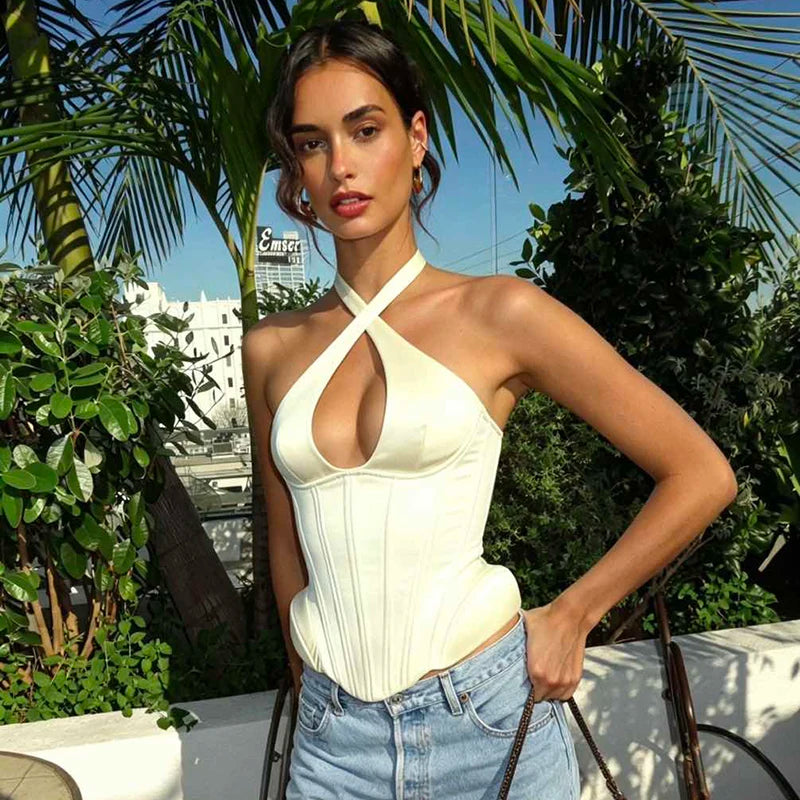 Model wearing halter neck cutout corset top
