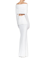 White off-shoulder draped top and high-waist maxi skirt with long gloves from back.