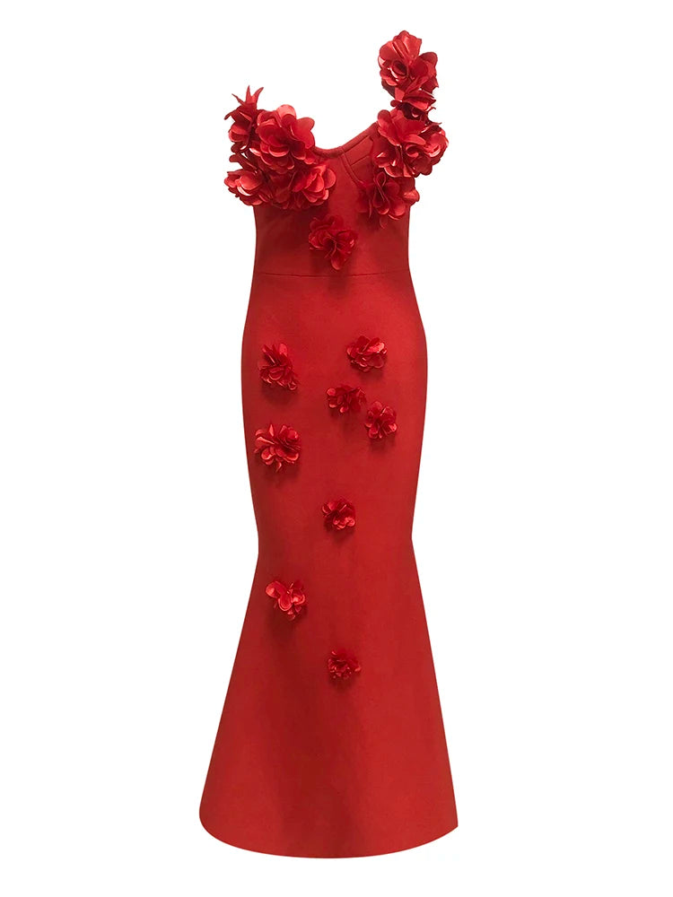 Red evening gown with floral embellishments on a white background