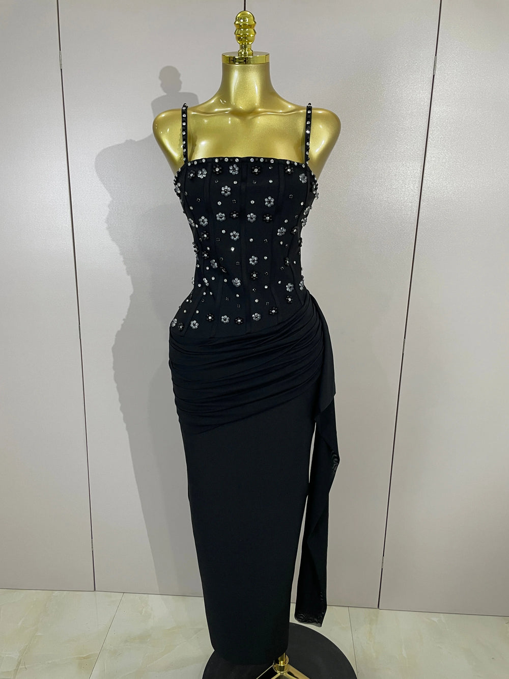 Black bodycon midi dress with embellished bodice and spaghetti straps