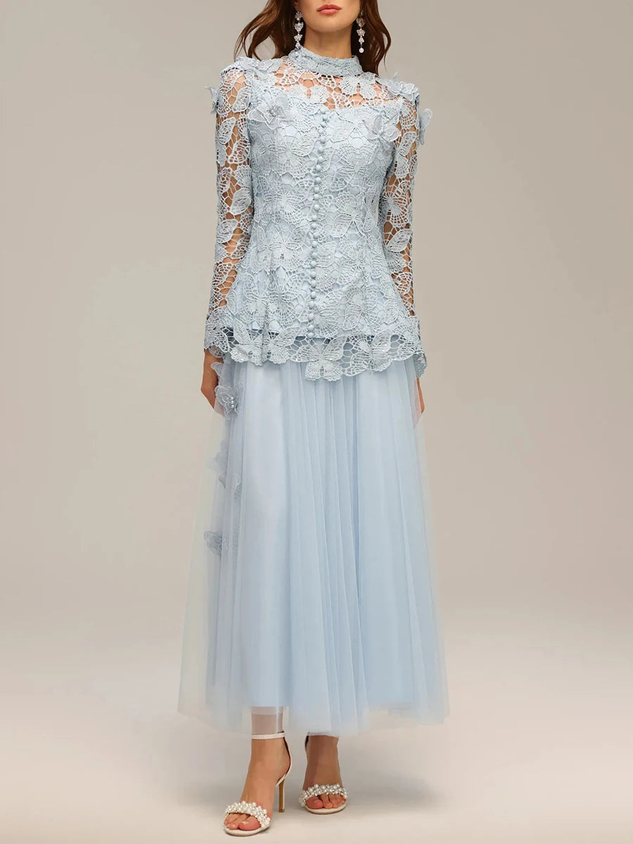 Light blue lace dress with long sleeves on a plain background