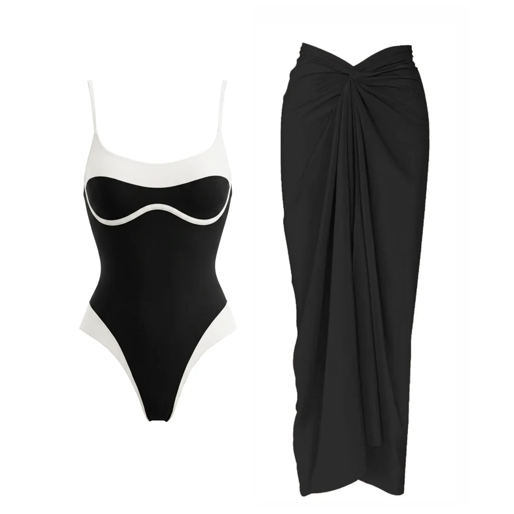Black and white contrast trim one-piece swimsuit and draped black sarong
