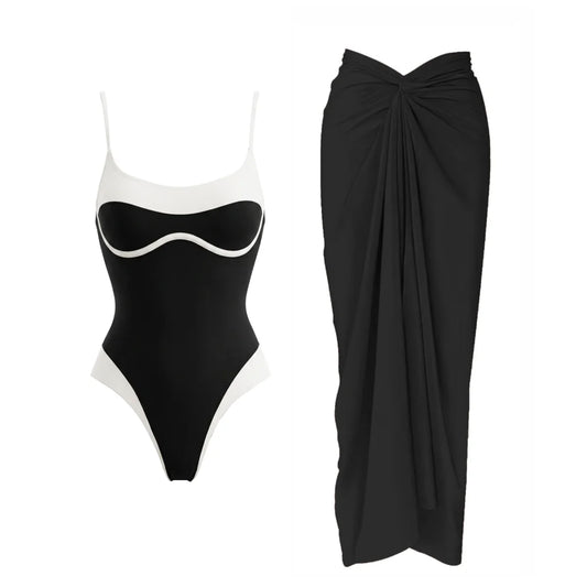 Black and white contrast trim one-piece swimsuit and draped black sarong