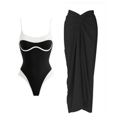 Black and white contrast trim one-piece swimsuit and draped black sarong