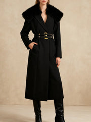 Black coat with fur collar and gold belt on a beige background