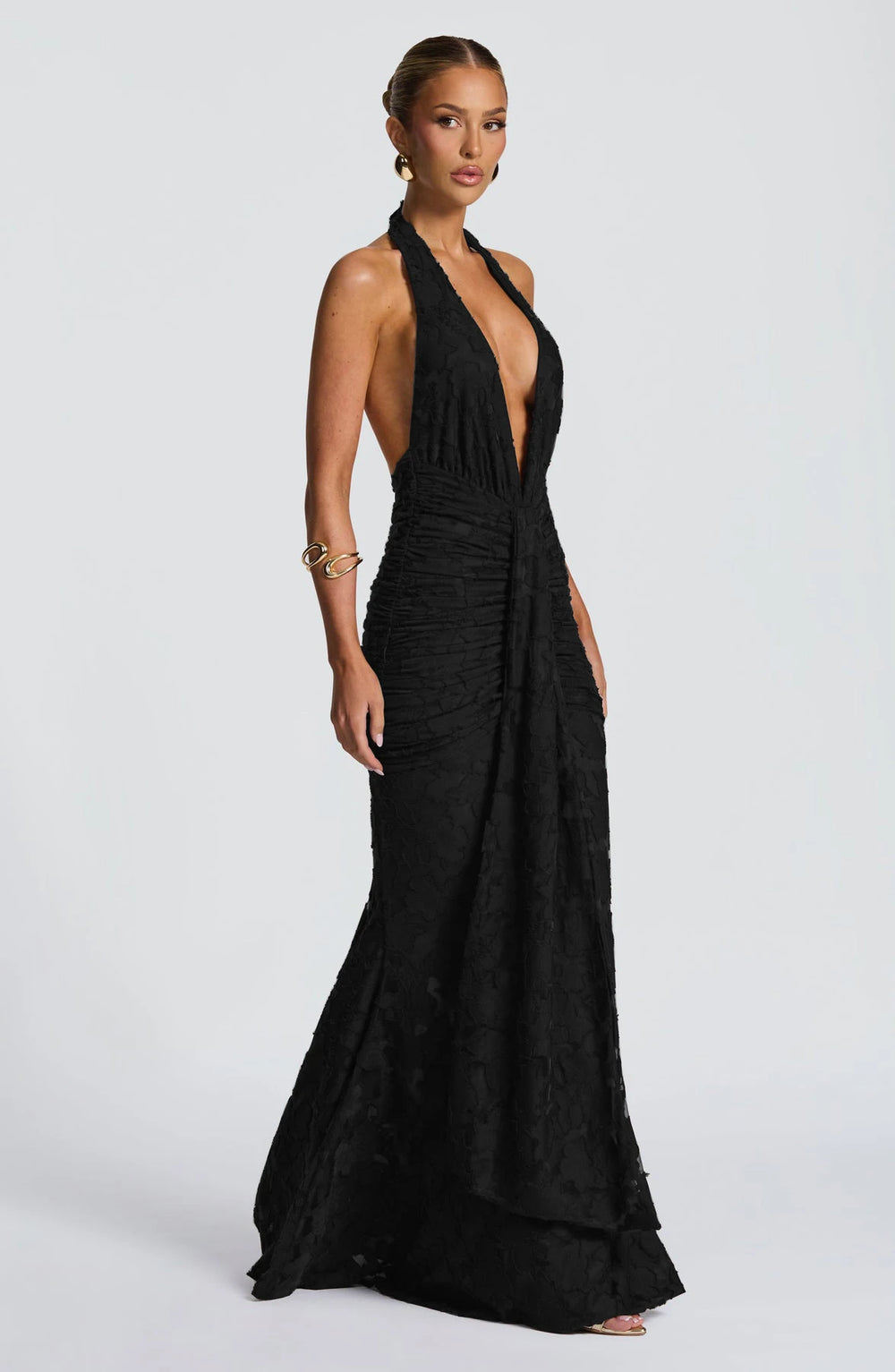 Black halter neck gown on a white background