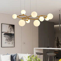 Magic Beans chandelier with smoke grey glass pendants hanging in a modern living room. Golden Atelier 3