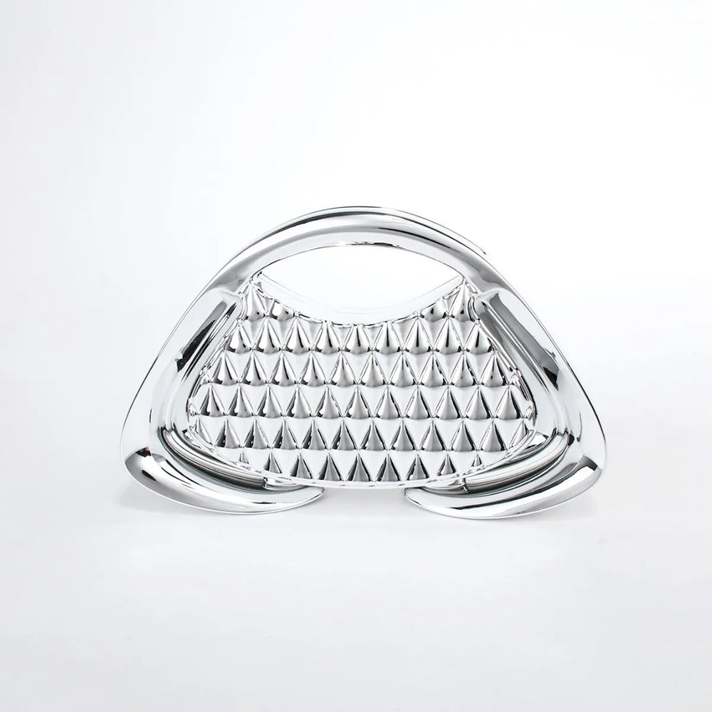 Triangular metallic object with pyramid pattern on a white background