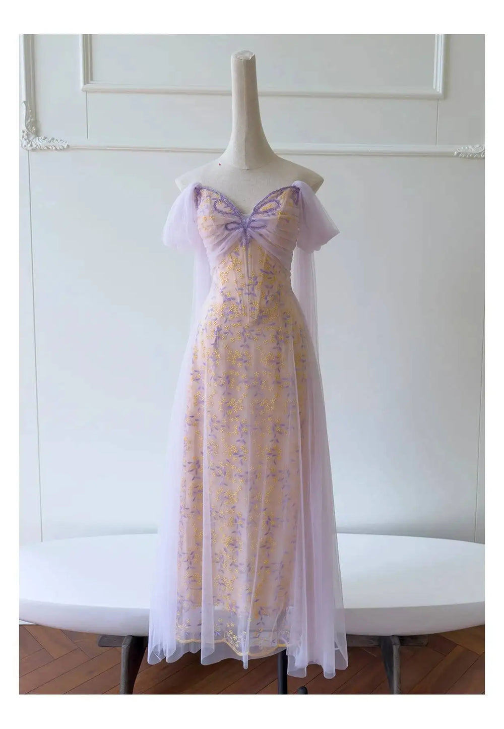 Embroidered butterfly tulle overlay maxi dress on mannequin