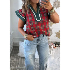 Close-up of plaid V-neck top with ruffle sleeves