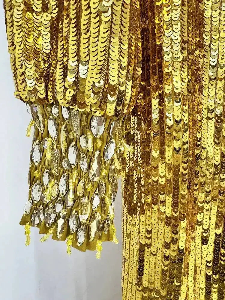Gold sequin fabric with a white background