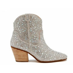 Silver studded ankle boot on a white background