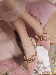 Model wearing pink floral vine kitten heels