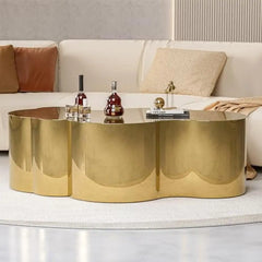 Gold stainless steel cloud shape coffee accent table, minimalist modern style.

