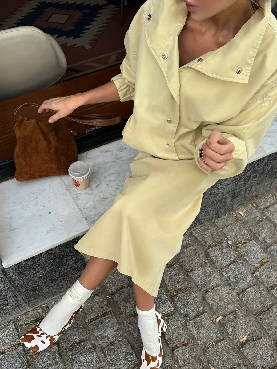 Close-up of yellow utility jacket and midi skirt set