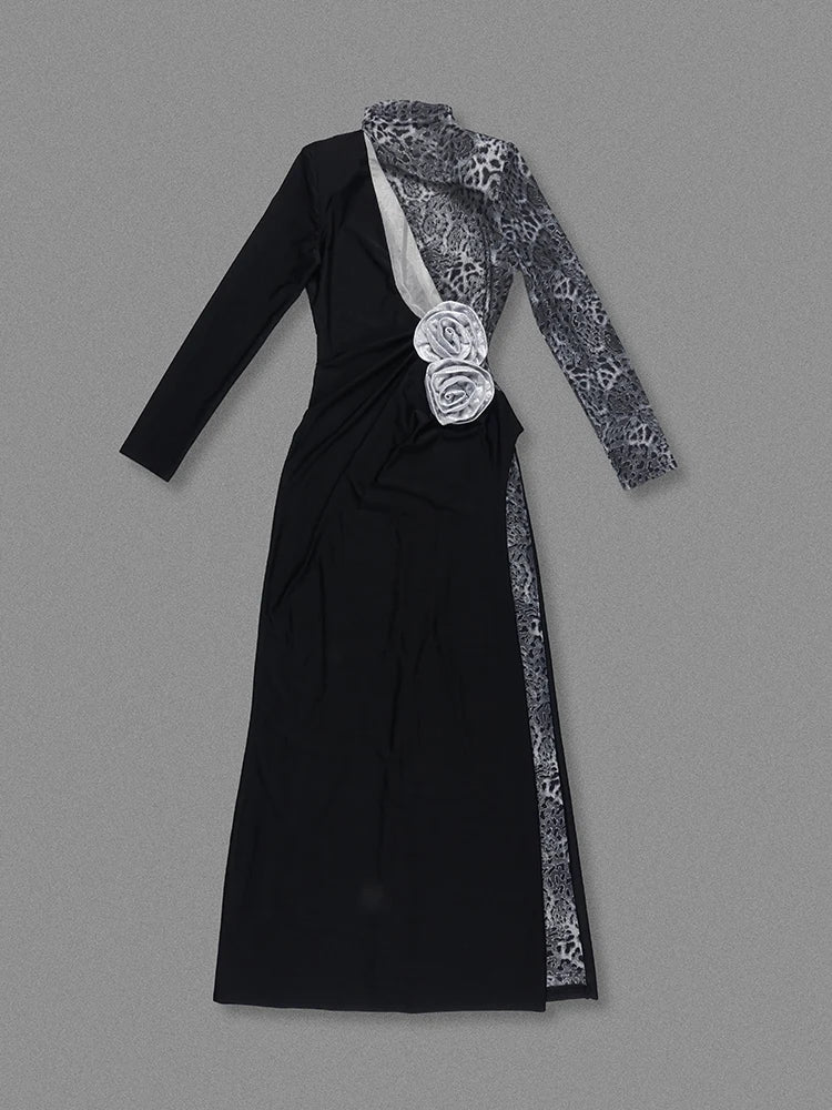 Black dress with floral details on a gray background