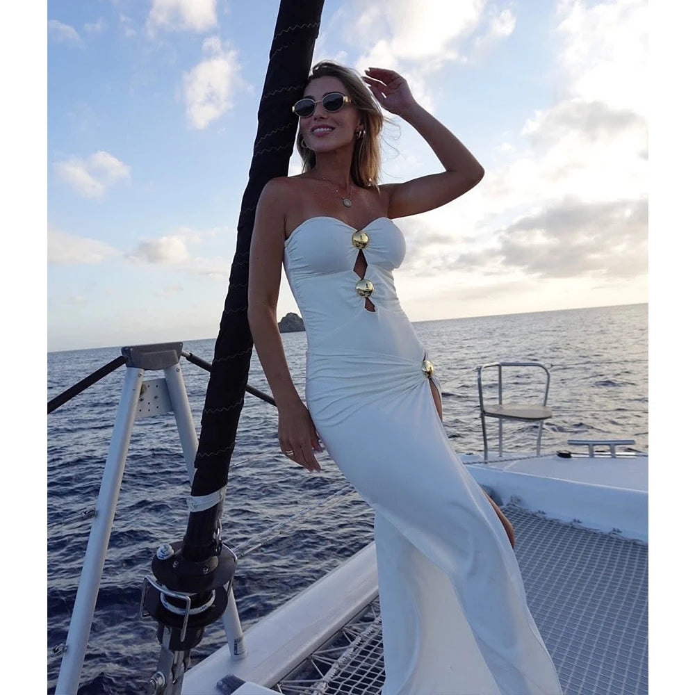 Monochrome high-slit one-piece swimsuit with gold-tone button details.