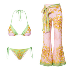 Two-piece bikini set with baroque print and green trim.