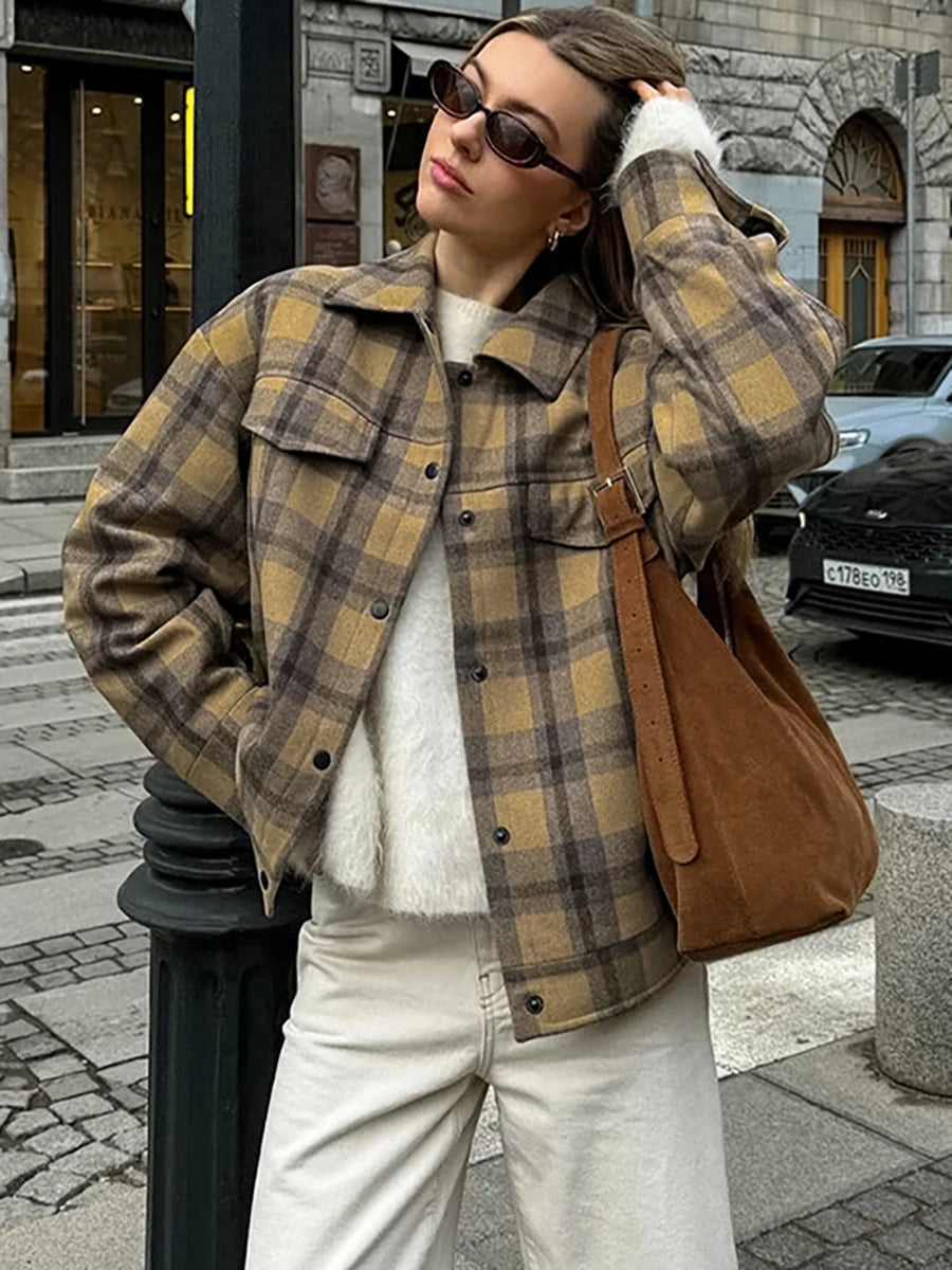 A woman wearing a stylish plaid wool coat with a turndown collar, perfect for fall. Golden Atelier 1