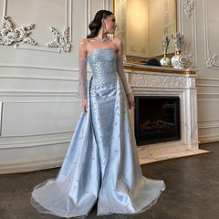 A model wearing the silver-gray evening gown with overskirt, showcasing its flattering silhouette and graceful movement.  Golden Atelier 4