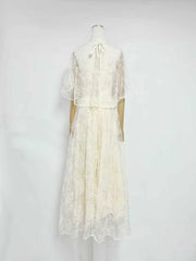 Back view of white lace cape sleeve maxi dress