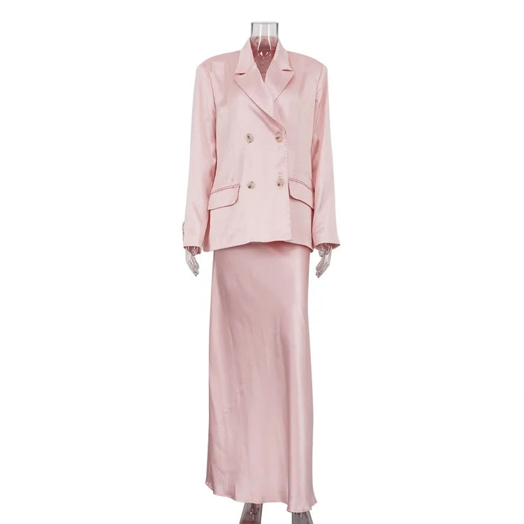 Pink suit on a mannequin against a white background