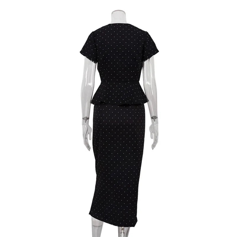Black polka dot dress on a mannequin 