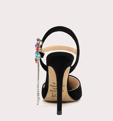 Black high-heeled shoe with colorful embellishments on a white background