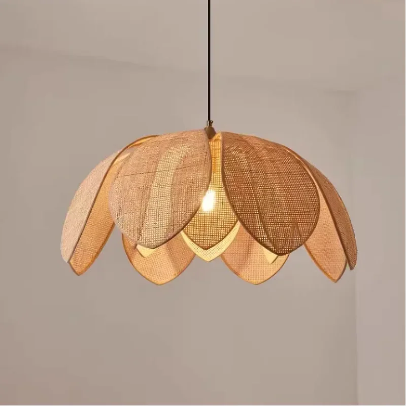 Bohemian rattan petal pendant light with handwoven wicker shade hanging from ceiling