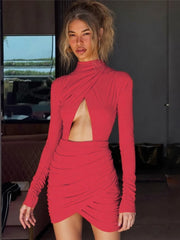 Woman wearing a red dress with cut-out design in an indoor setting