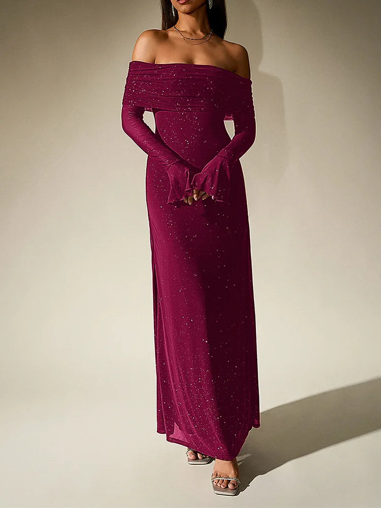 Magenta off-shoulder gown with long sleeves on a plain background