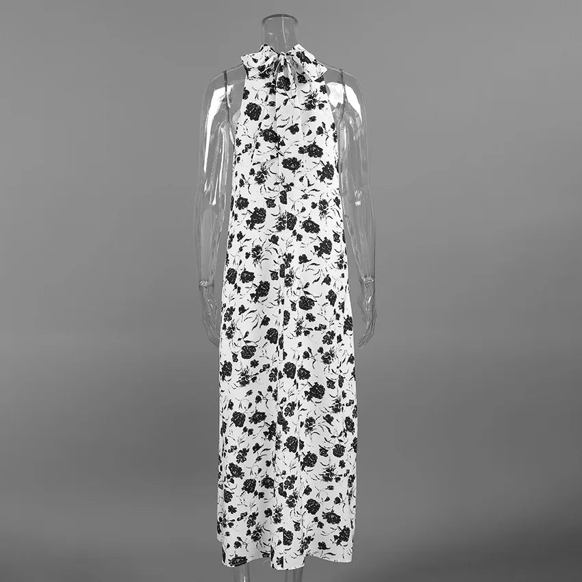 Black and white floral dress on a mannequin against a gray background