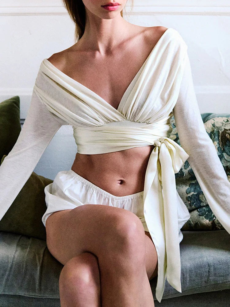 Off shoulder wrap crop top with bell sleeves tied at waist