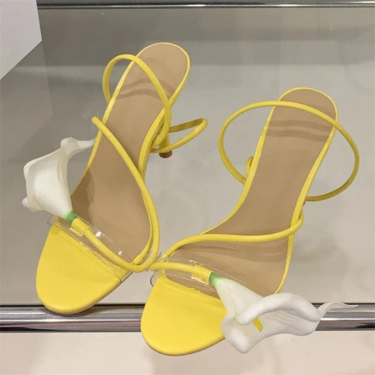 Transparent flower stiletto heels in yellow with yellow straps