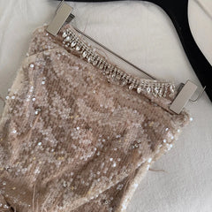 Close-up of the strapless sequin mini dress neckline and embellishments