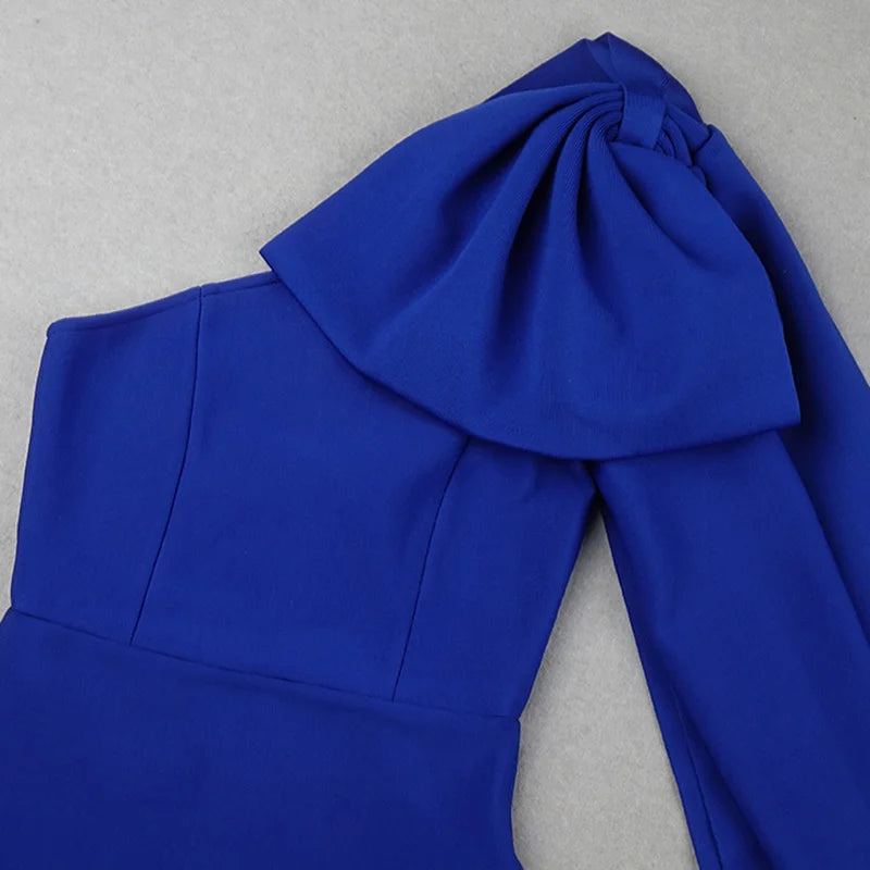 Blue garment with a large bow on a gray background