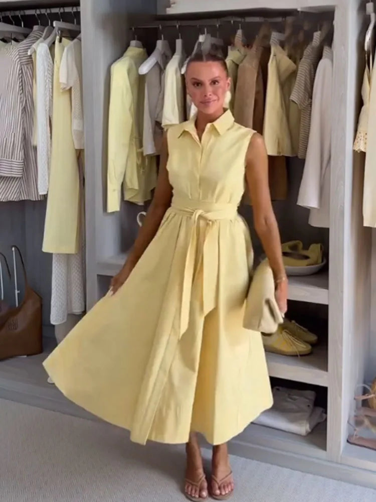 Woman wearing a yellow dress in a clothing store