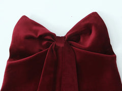  Women's strapless top with a bow accent and open back.