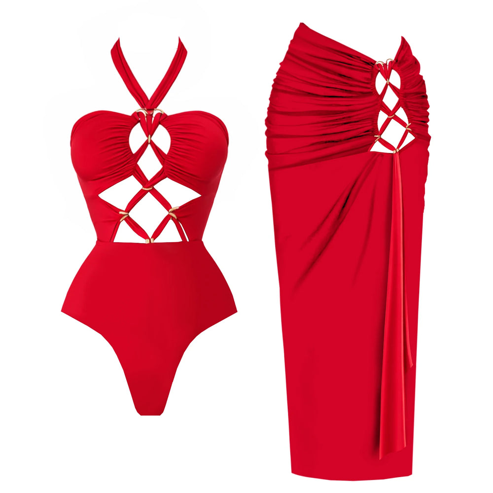 Red halter neck crisscross cutout one-piece swimsuit with gold hardware and matching ruched sarong skirt.