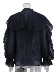Black sheer blouse on a mannequin with a white background
