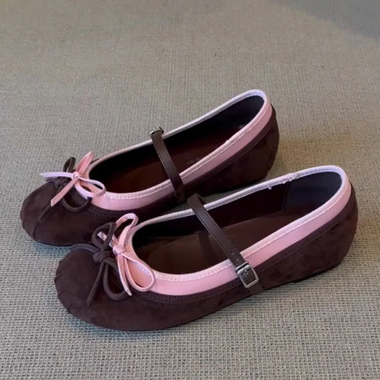Round toe suede ballet flats with pink trim and pink bowknot