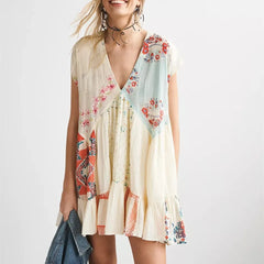 Woman wearing a floral dress with a scarf on a white background